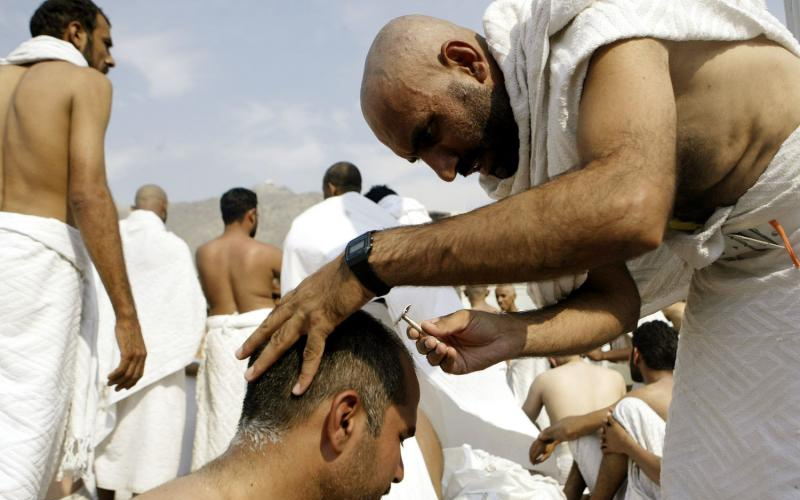 Muslim pilgrim having his hair cut-Why Do Muslims Cut Their Hair In Hajj