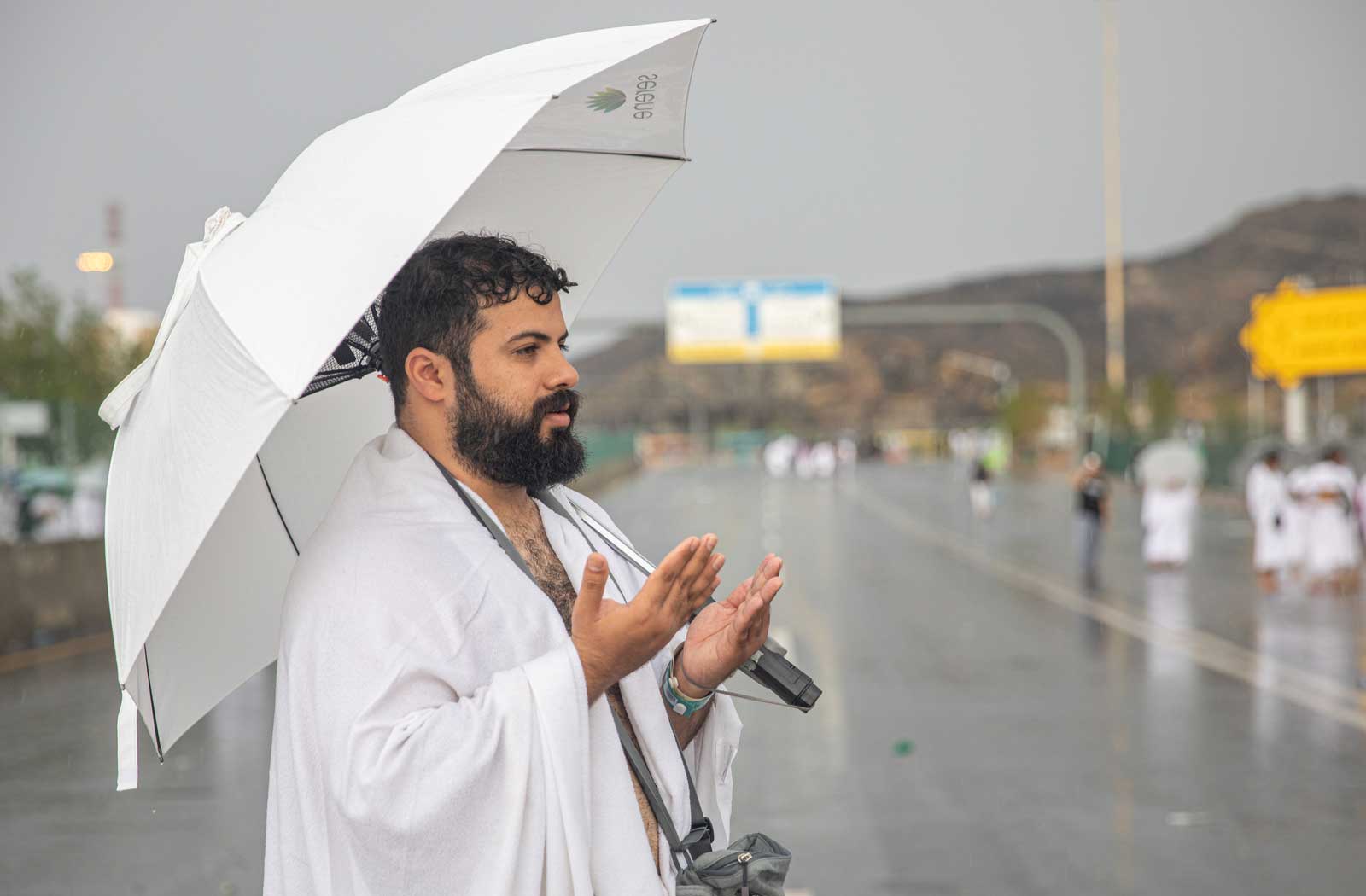 Muslim man making duaa in hajj