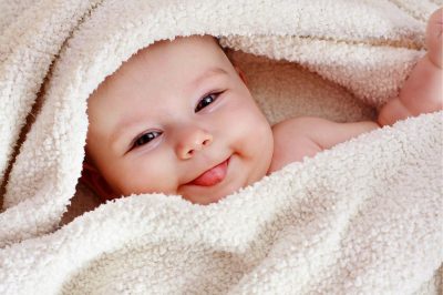 baby smiling-Is It Necessary to Shave Newborn's Hair?