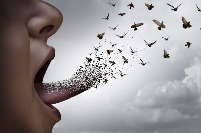 Communication concept a a person with an open mouth voicing