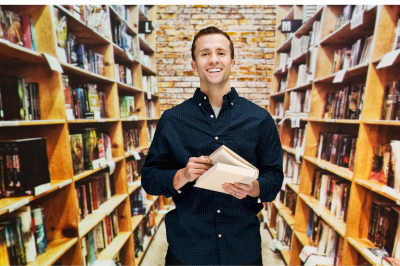 male-librarian-in-library-Can You Work as Librarian in Christian University?