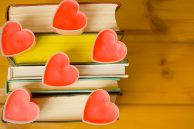love-hearts-on-books-on-wooden-background-book-lovers-Is Reading Homosexual Romance Books Halal?