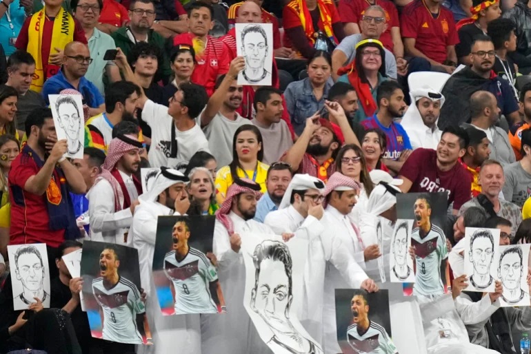 Holding Mesut Ozil Pics, Fans Remind Germany of Racism - About Islam
