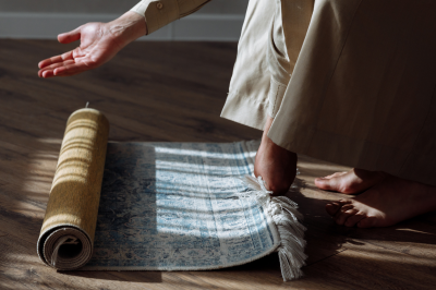 Muslim rolling out a prayer rug-Importance of prayer in Islam
