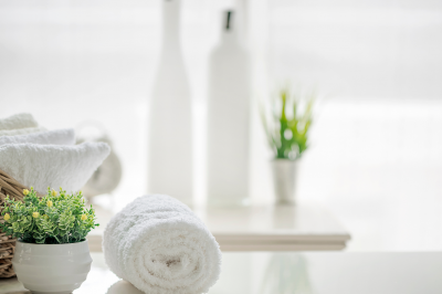 white towels on white table-Do You Have to Shave Pubic Hair after Your Period?